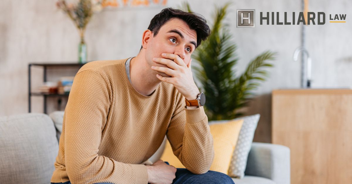 man covering his mouth